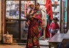 Woman_with_her_baby_outside_Indian_pharmacy